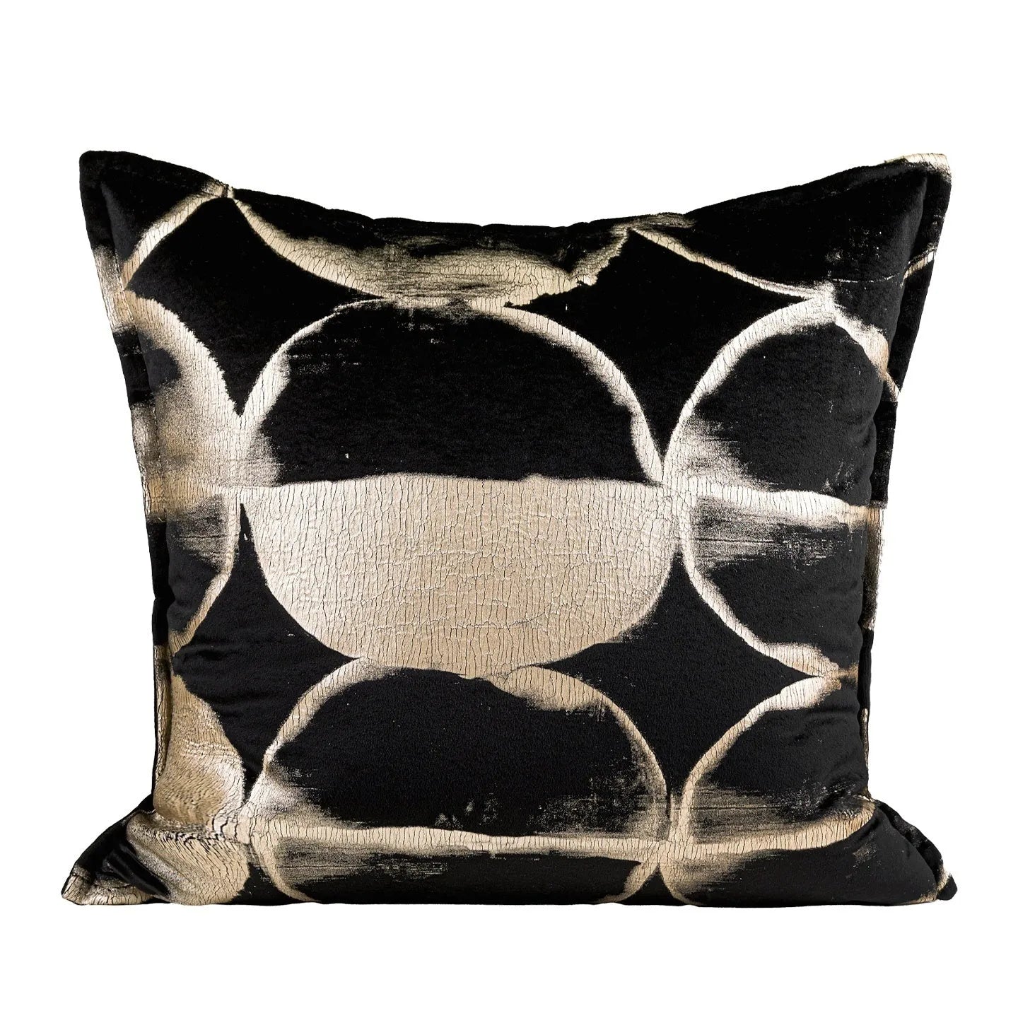 Black and gold abstract patterned square decorative pillow with a flannel cover on a grey sofa.
