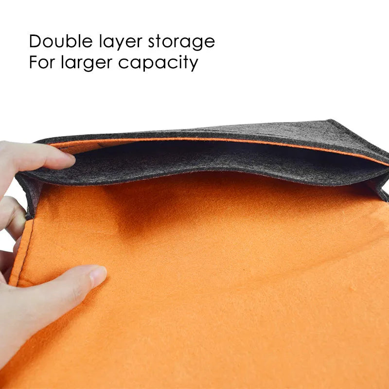 Black felt pouch case for Nintendo Switch open to show console compartment and 5 game card slots.