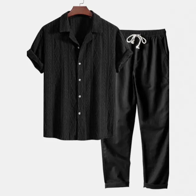 Men's slim fit camouflage print linen-style suit with short sleeve shirt and trousers on a hanger.