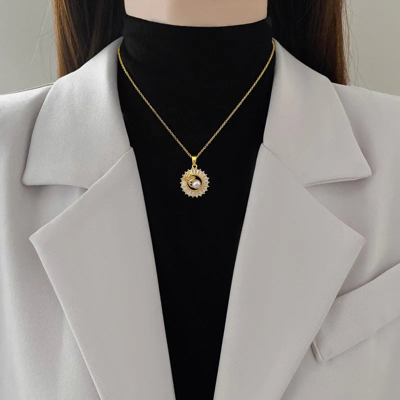 Titanium steel and gold plated geometric jewellery set showing necklace with copper pendant and matching stud earrings