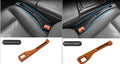 Black plastic car seat gap storage box organiser with handle between car seat and console