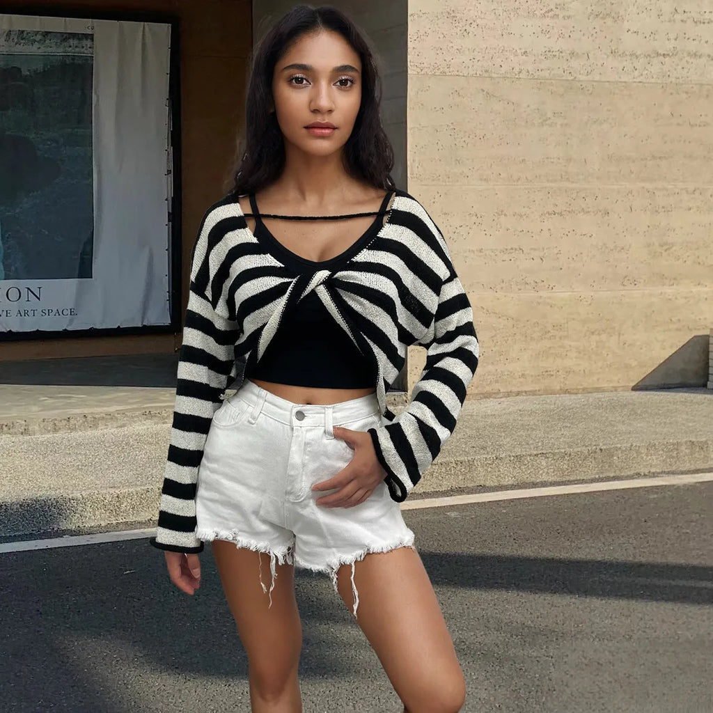 Striped long-sleeved sweater with front and back wearable design and exposed navel detail.