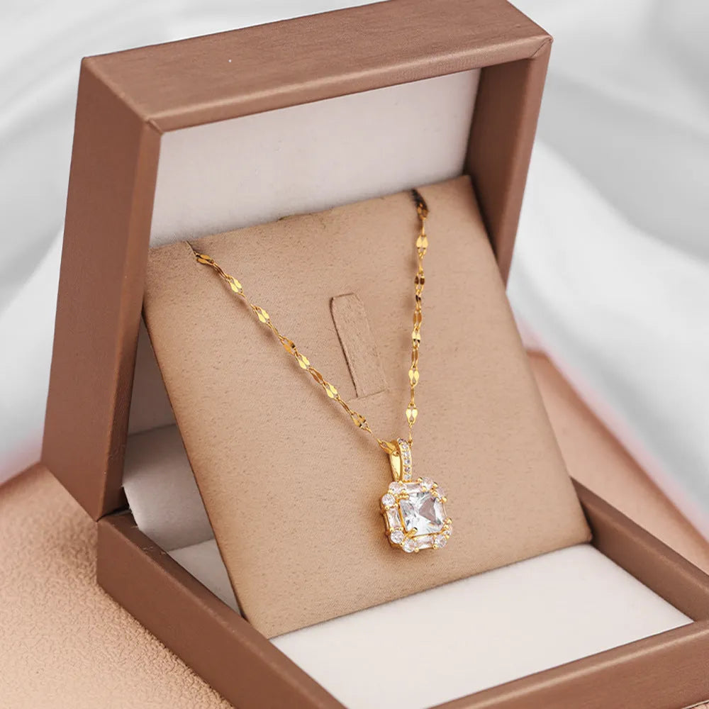 Gold titanium steel necklace with geometric quadrilateral pendant featuring mixed gemstone inlay on water wave chain