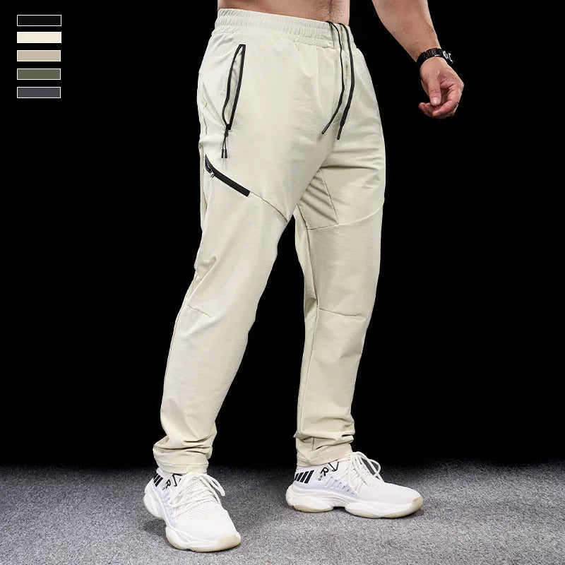 Men's black waterproof quick-drying nylon workout pants for sports and exercise.