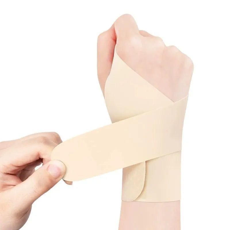 Adjustable black breathable wristguard worn on wrist for sports like badminton and tennis.