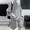 Waffle texture leisure sports suit set consisting of a short sleeve top and shorts, shown in blue.