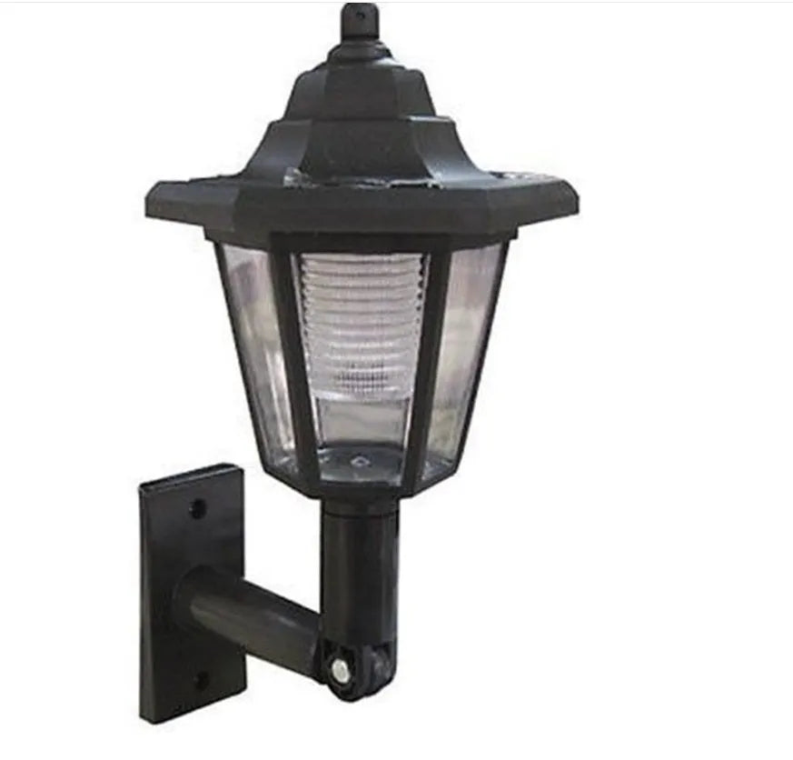 Black hexagonal solar-powered outdoor wall lamp with LED light.