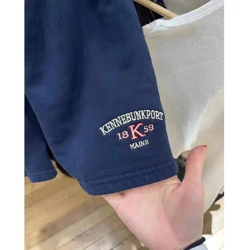 Women's dark blue cotton sports shorts with white flag embroidery and navy blue trim