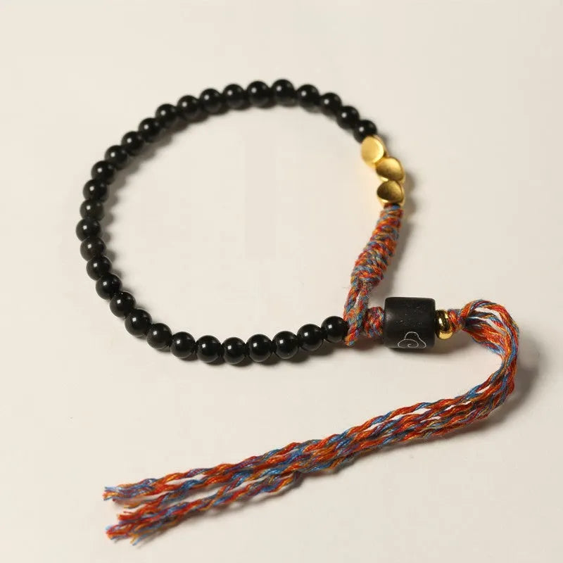 Hand-woven obsidian carrying strap showing woven texture and adjustable 15.5-16cm length
