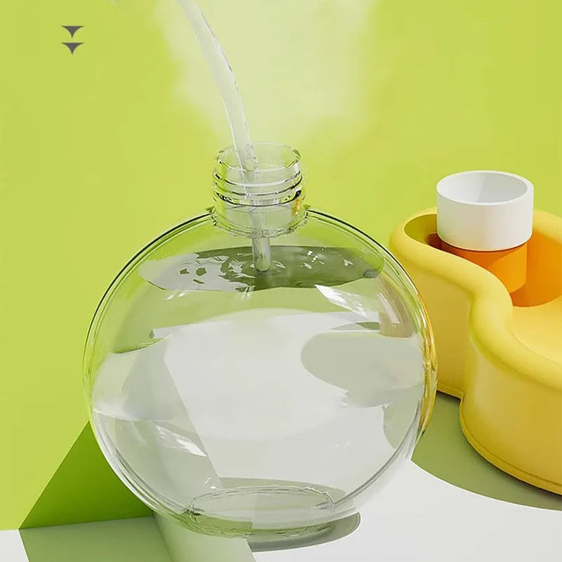 Green dog travel water bottle with pull-out drinking bowl for outdoor use