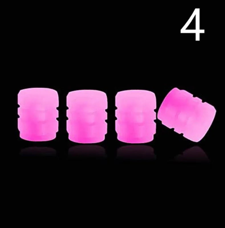 Luminous rubber tyre valve caps with a split design shown in light green, blue, red, yellow, and pink colours.