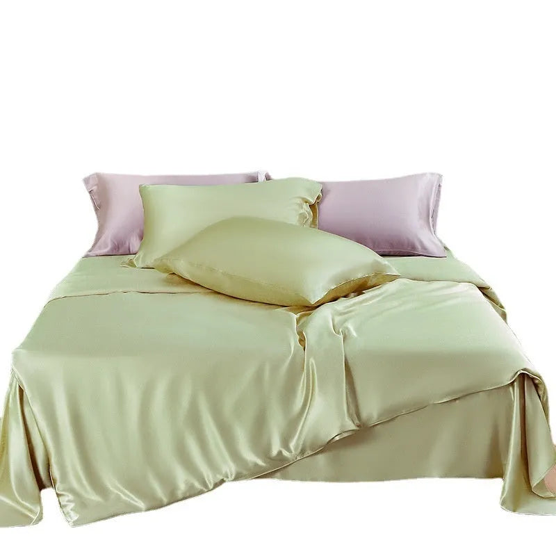 Double-sided silk duvet cover in solid colours showing lotus pink, pea green, and bright brown options