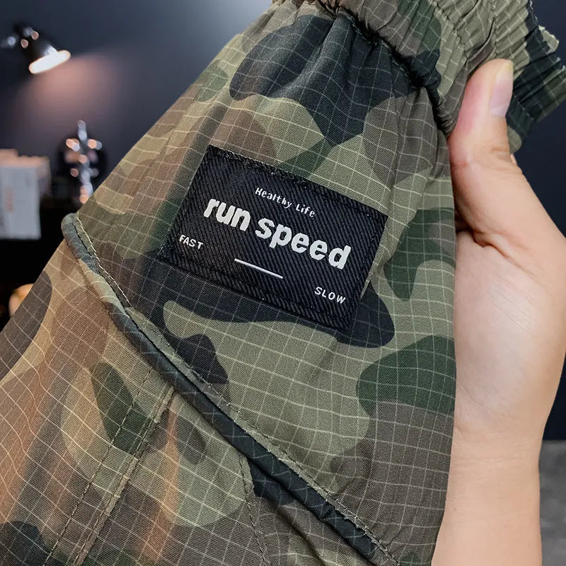 Men's camouflage cargo shorts with cargo pockets and loose fit design