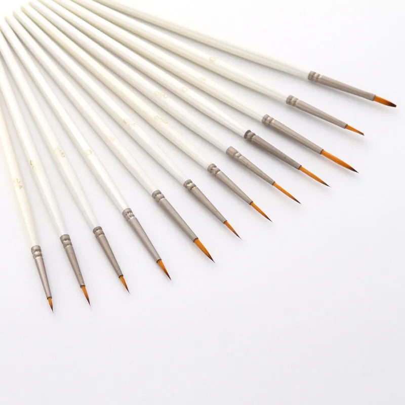 Set of 12 fluorescent pearl white nylon wool hook art brushes in a solid wood pen holder.