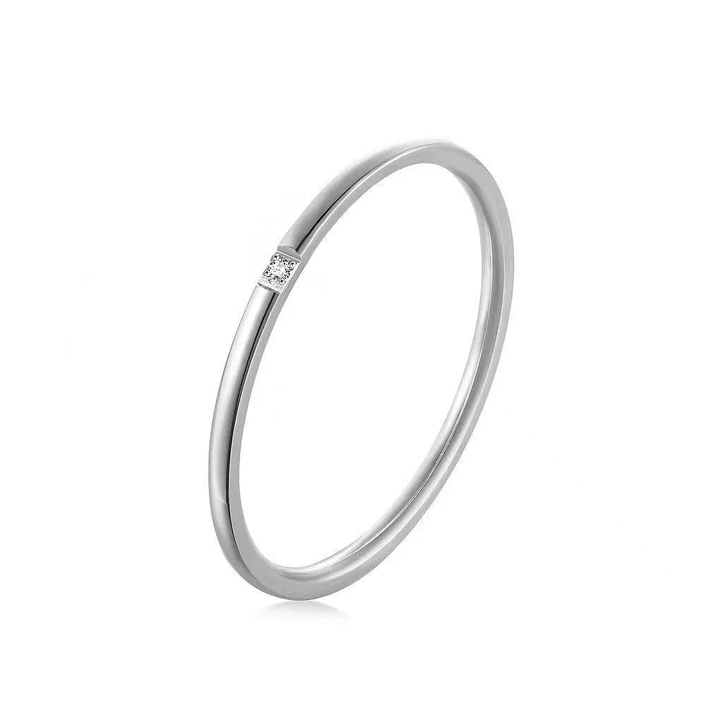Stainless steel diamond-set ring in silver, gold or rose gold with 1 or 3 round stones, sizes 5 to 11