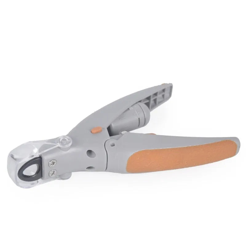 ABS plastic dog nail clipper with light on and imitation blood line guide visible on cutting head.