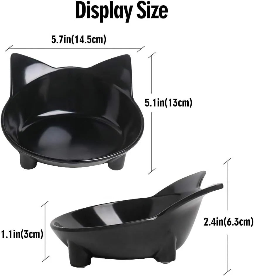Four shallow black melamine pet bowls with non-slip rubber bases on a table.