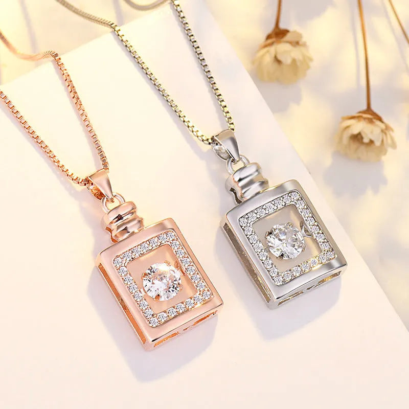 Sterling silver heart pendant necklace with crown and bow detail in rose gold or silver finish