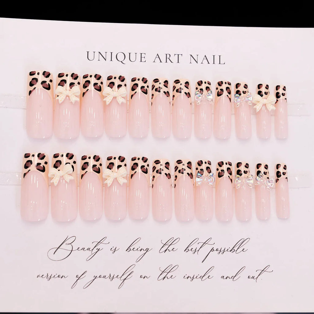 Leopard print false nail art kit with plastic butterfly decorations in colour WM296.