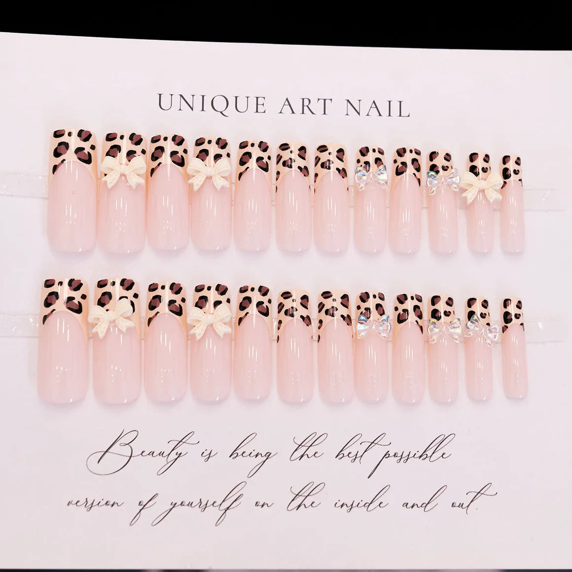 Leopard print false nail art kit with plastic butterfly decorations in colour WM296.