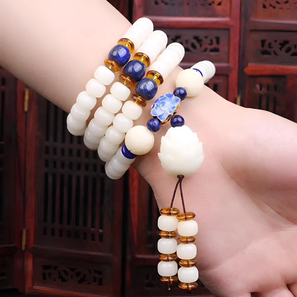 White jade Bodhi seed bracelet with 6x8mm beads in one of nine style options.