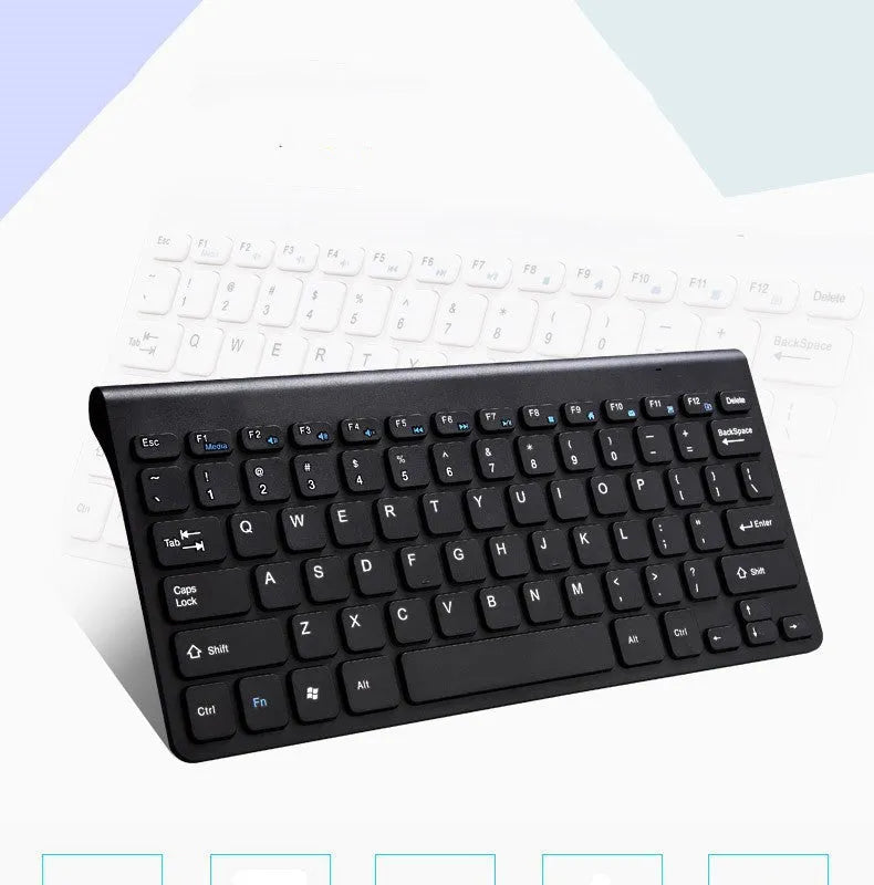 Black and white wireless keyboard and mouse set with USB receiver on wooden desk