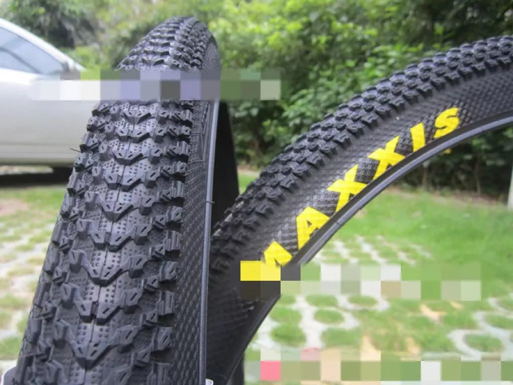 Ultralight puncture-proof mountain bike tyre showing tread pattern and available size options