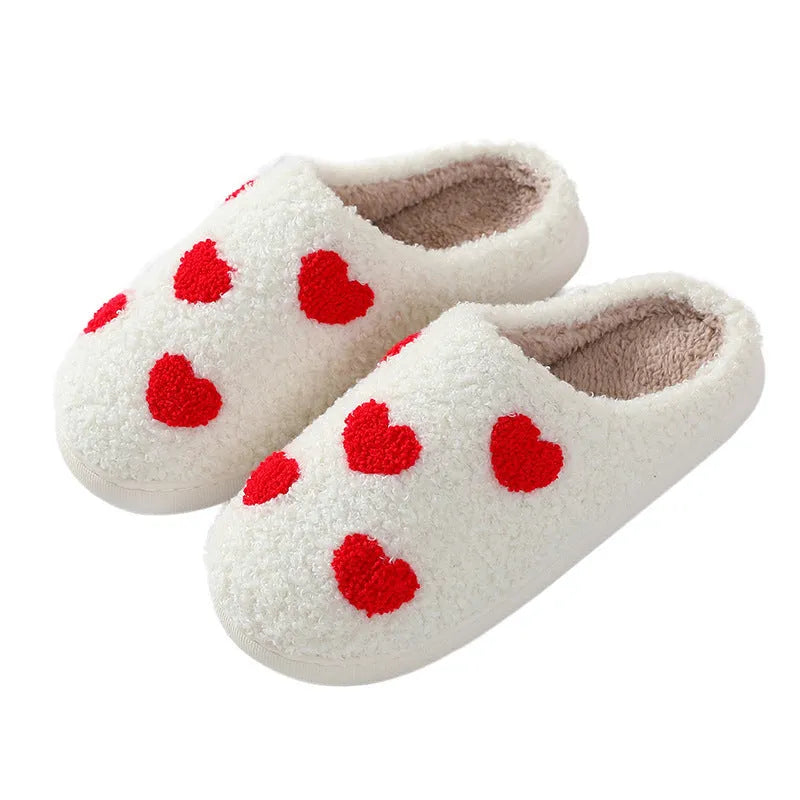 Adult women's plush cartoon-style home slippers with non-slip PVC soles in multiple colour options.