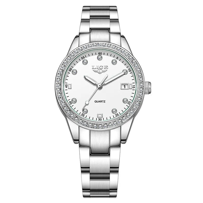 Silver stainless steel women's quartz watch with diamond bezel and luminous hands on a round 34mm dial.