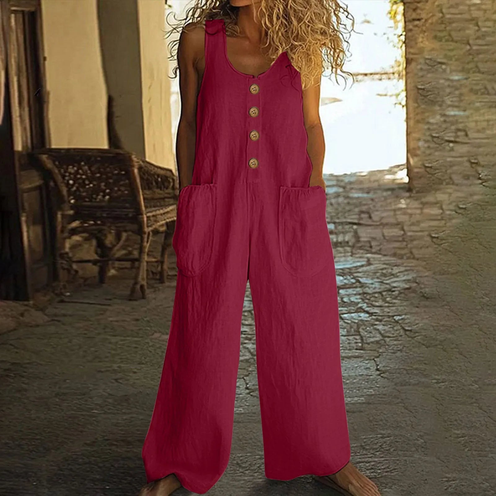 Sleeveless cotton jumpsuit with wide leg trousers in retro style showing side pocket detail