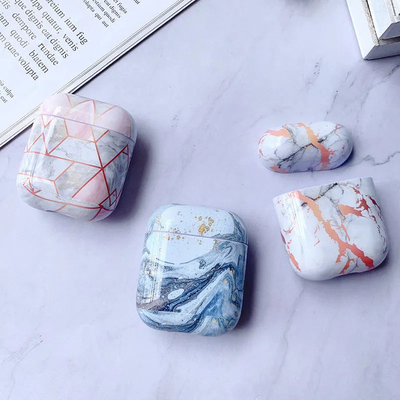 White marble pattern hard case covering an Apple AirPods charging box.