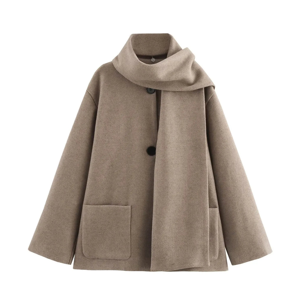 Women's long grey polyester overcoat with artificial fur collar and pockets, styled in street fashion.