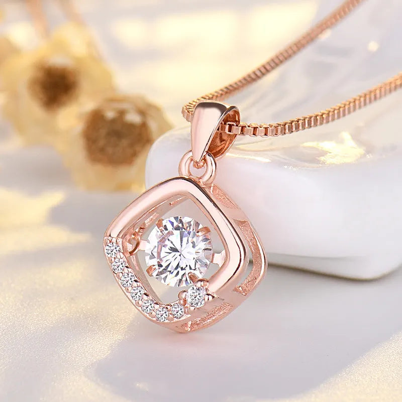 Sterling silver heart pendant necklace with crown and bow detail in rose gold or silver finish