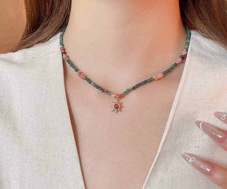 Freshwater pearl necklace with stone sun pendant on clavicle chain