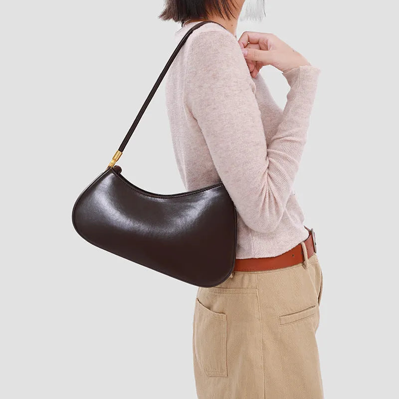 Retro oval women's underarm shoulder bag in PU leather with single strap and zippered interior