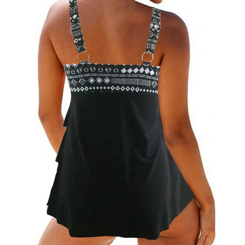 Plus size women's swimsuit with double shoulder straps, a bow, and a split skirt in polyester fabric.