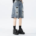 Black and Blue ripped denim shorts with a washed vintage finish and loose, retro fit.