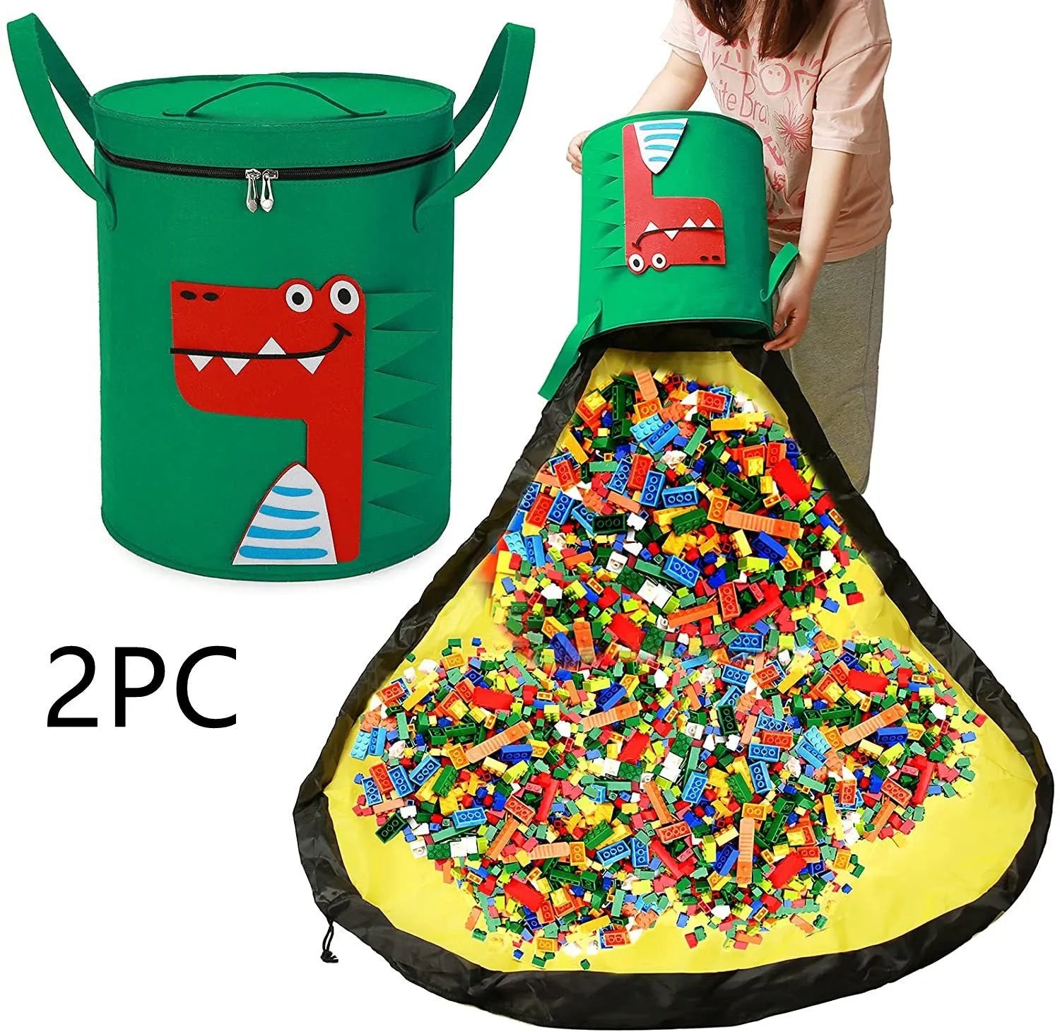 Green felt cube storage bag open showing toys inside, laying flat as play mat
