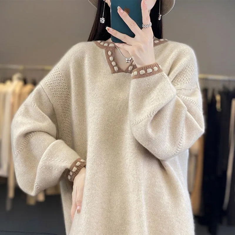 Women's white V-neck long sleeve viscose sweater on a hanger.