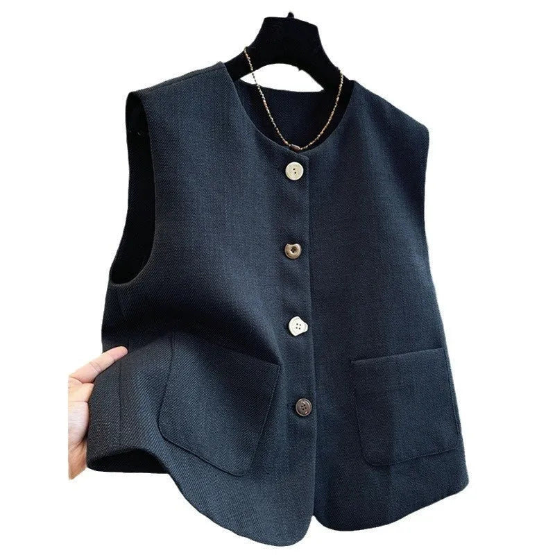 Women's round neck sleeveless vest in milky white, French bandage style, shown front view.