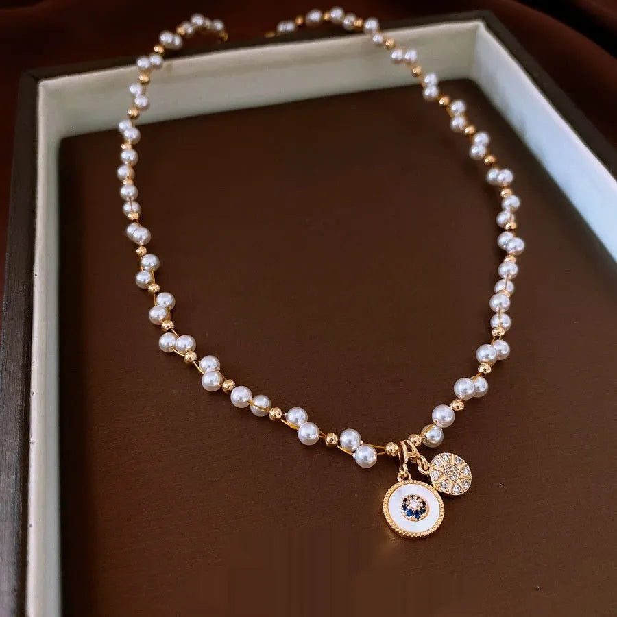 Real gold electroplated pendant necklace with round zircon-inlaid imitation pearl on adjustable clavicle chain