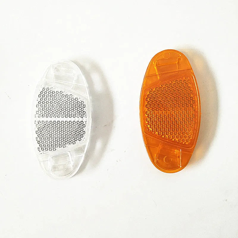 White and yellow bicycle spoke reflectors with plastic construction and night warning film