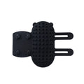 Silicone cat grooming comb with adjustable strap mounted on a table leg, shown in yellow.