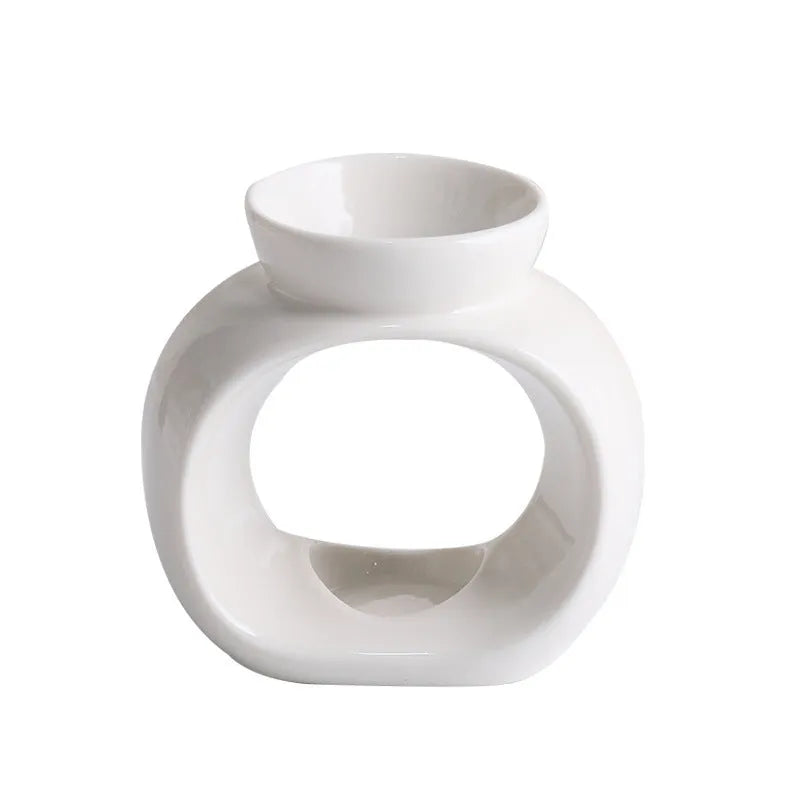 White Nordic style ceramic aromatherapy stove ornament on a tabletop