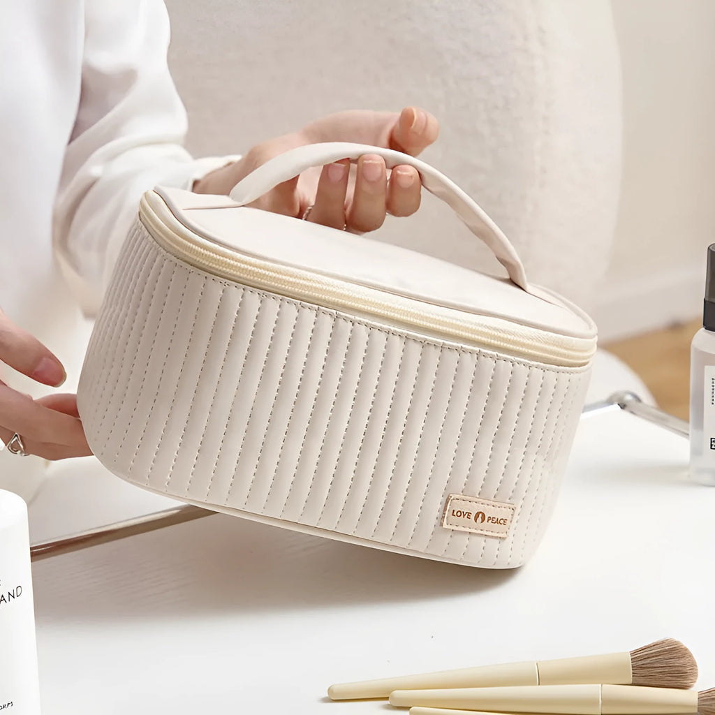 Open-top makeup bag in PU leather shown in a choice of six solid colours.