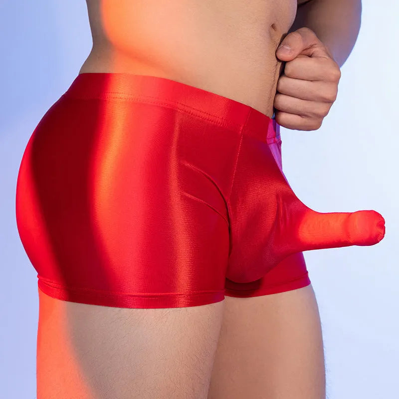 Men's seamless nylon boxer shorts in red with elephant pattern, showing mid-waist design and hip-lifting fit