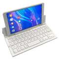 Black and white mini folding wireless Bluetooth keyboard for tablets, shown open with numeric keypad.