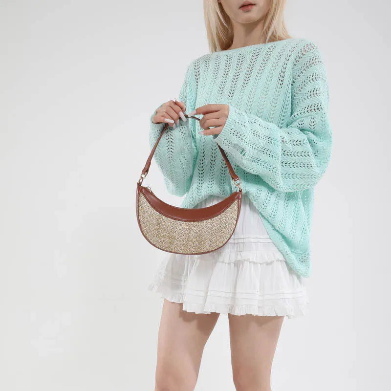 Hard straw crossbody dumpling bag showing sandwich pocket and internal zipper compartments