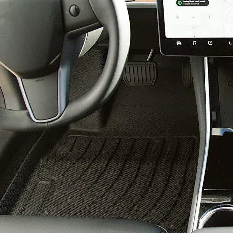 Tesla floor mats made from black rubber with textured TPE footrest section for Model 3, Y, S, and X vehicles