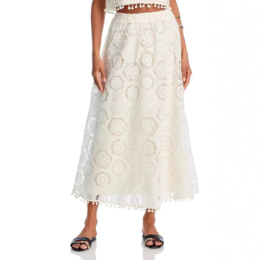 White women's two-piece suit set with embroidered sleeveless top and matching long skirt